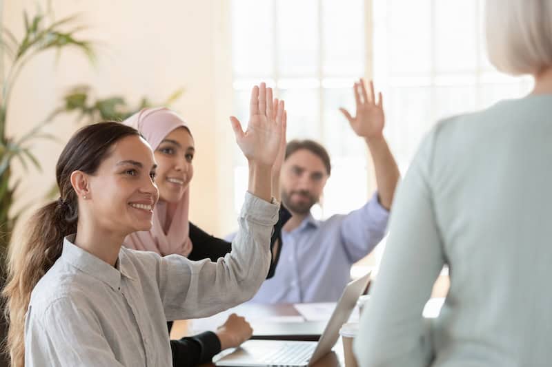Multicultural group of employees in committee Meeting