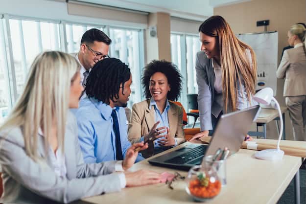A group of young business professionals collaborating in a productive meeting.